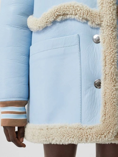 Shop Burberry Two-tone Leather And Shearling Coat In Baby Blue