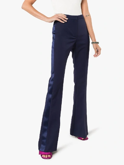 Shop Alexander Mcqueen Satin Trim Flared Trousers In Blue