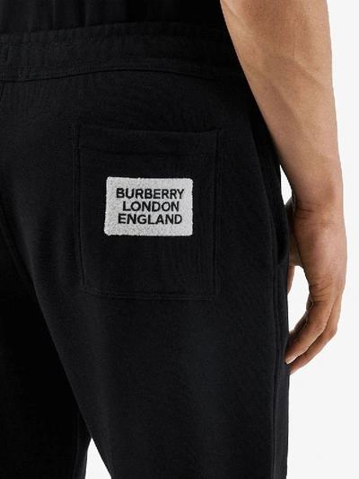 Shop Burberry Logo Appliqué Track Pants In Black