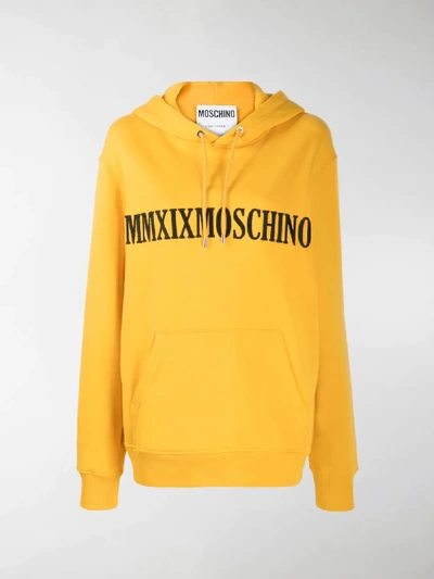 Shop Moschino Logo-embroidered Oversized Hoodie In Yellow
