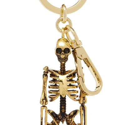 Shop Alexander Mcqueen Dancing Skeleton Keyring In Gold
