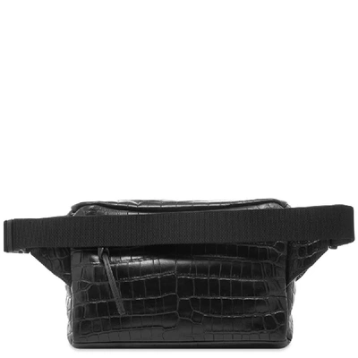 Shop Saint Laurent Embossed Croc Waist Bag In Black