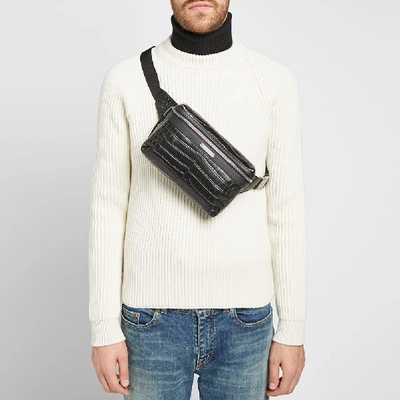 Shop Saint Laurent Embossed Croc Waist Bag In Black