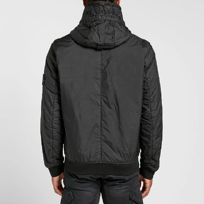 Shop Stone Island Garment Dyed Crinkle Reps Ny Piping Hooded Jacket In Black