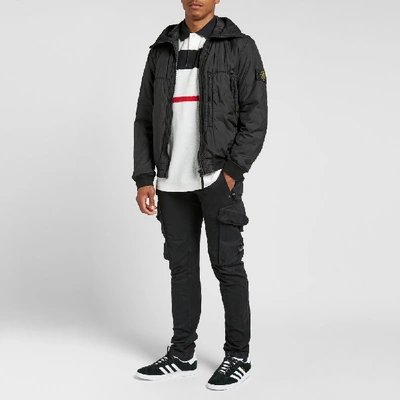 Shop Stone Island Garment Dyed Crinkle Reps Ny Piping Hooded Jacket In Black