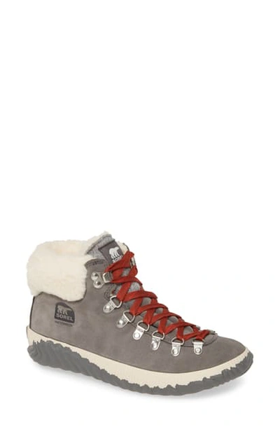 Shop Sorel Out 'n About(tm) Conquest Waterproof Bootie With Faux Fur Trim In Quarry Suede