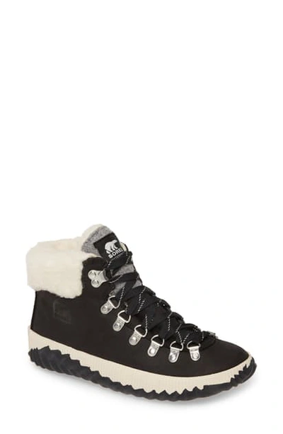 Shop Sorel Out 'n About(tm) Conquest Waterproof Bootie With Faux Fur Trim In Black Suede
