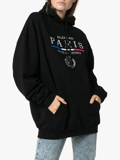 Shop Balenciaga Paris Logo Hoodie In Black