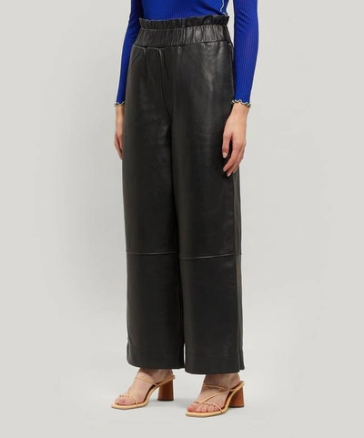 Shop Ganni Leather Wide-leg Trousers In Black