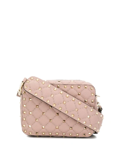 Shop Valentino Rockstud Cross Body Bag In Pink
