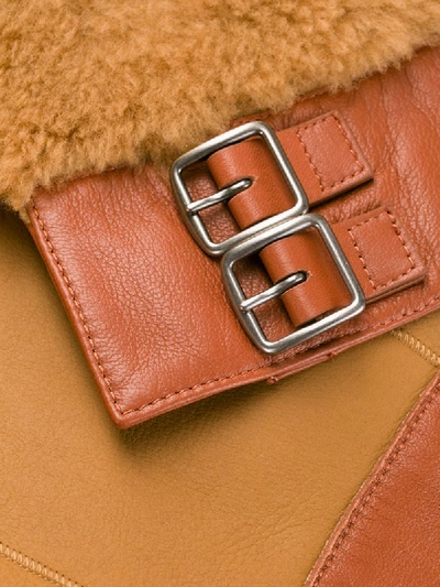 Shop Coach Buckled Shearling Jacket In Brown