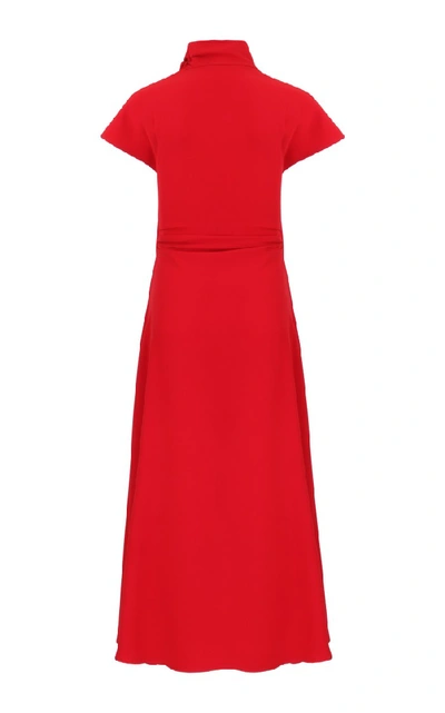 Shop Amal Al Mulla Ruby Red Crepe Midi With A Long Side Slit And A Soft Turtle Neck Collar That Ties Into A Bow.