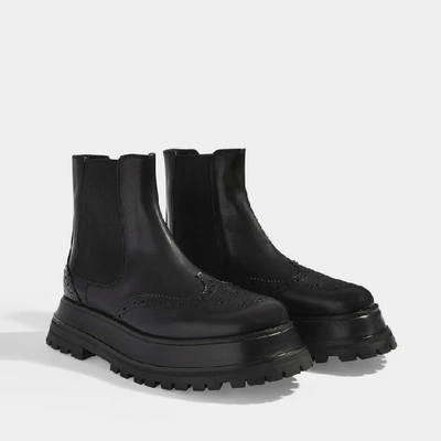 Shop Burberry Guideport Platform Ankle Boots In Black Calf Leather