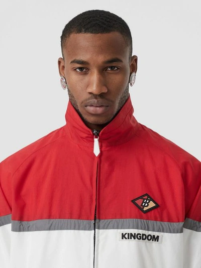 Shop Burberry Logo Graphic Striped Nylon Track Top In Bright Red