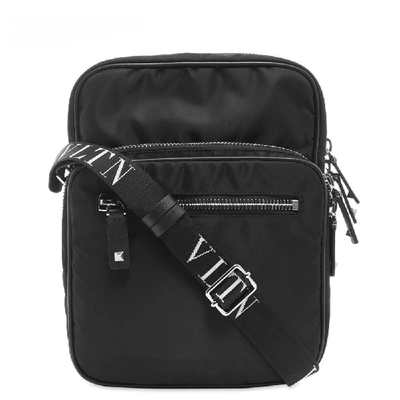 Shop Valentino Vltn Cross Body Bag In Black