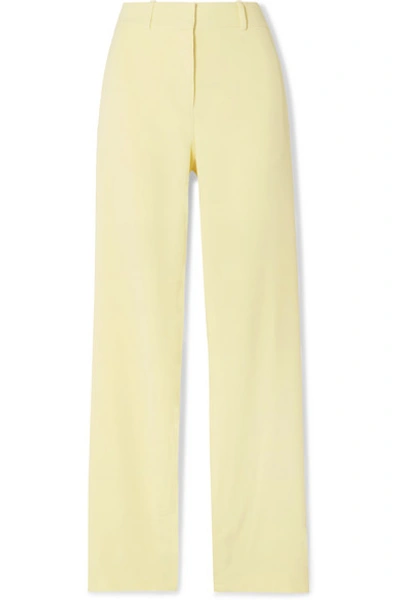 Shop Dion Lee Button-embellished Stretch-cady Pants In Pastel Yellow