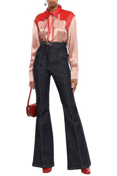 Shop Nina Ricci Belted High-rise Flared Jeans In Dark Denim