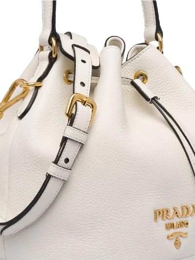 Shop Prada Logo Plaque Bucket Bag In White