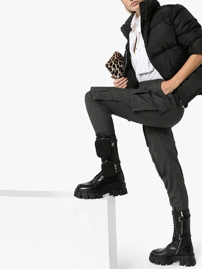 Prada Monolith Nylon Pocket-detailed Leather Combat Boots In Black