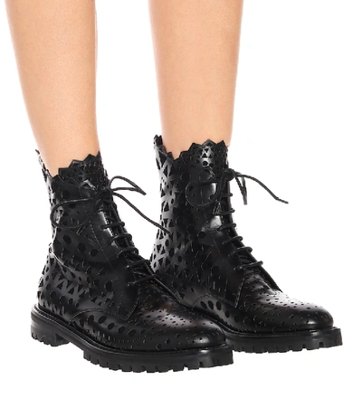 Laser Cut Buckled Leather Boots in Black - Alaia