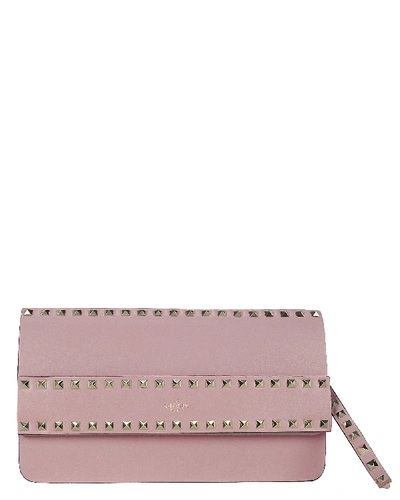 Shop Valentino Rockstud Leather Clutch In Pink