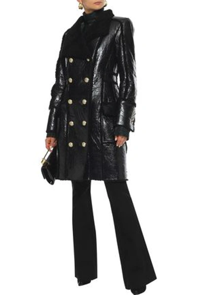 Shop Balmain Double-breasted Shearling And Glossed Cracked-leather Coat In Black