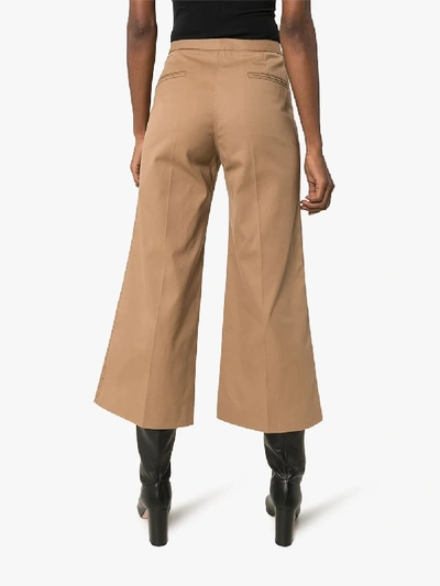Shop Lemaire Wide Leg Cropped Cotton Trousers In Brown
