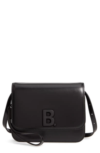 Shop Balenciaga B Shiny Leather Crossbody Bag In Black
