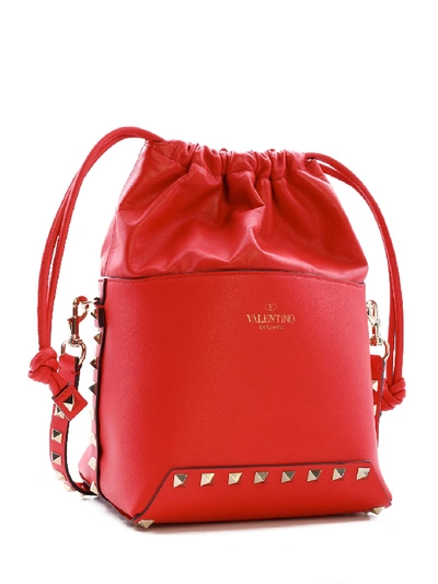 Shop Valentino Rockstud Bucket Bag In Red