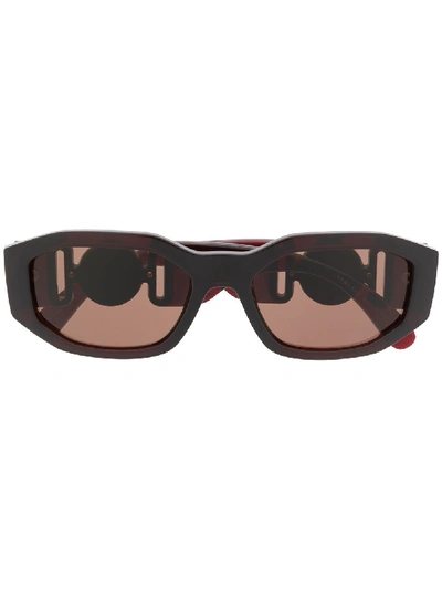Shop Versace Logo Embellished Sunglasses In Brown
