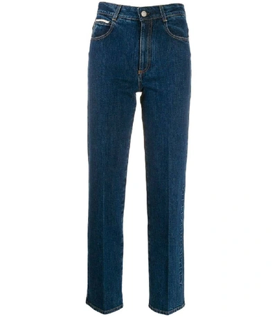 Shop Stella Mccartney Embossed Logo Straight Leg Jeans In Blue