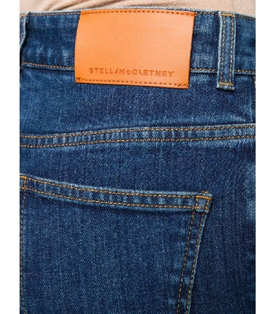 Shop Stella Mccartney Embossed Logo Straight Leg Jeans In Blue