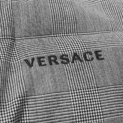 Shop Versace Check Print Down Jacket In Black