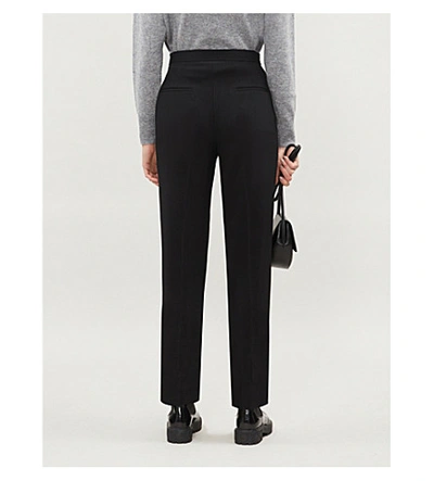 Shop Sandro Buckle High-rise Tapered Crepe Trousers In Black