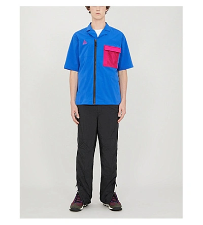 Shop Nike Patch-pocket Relaxed-fit Shell Shirt In Game Royal/sport Fuchsia