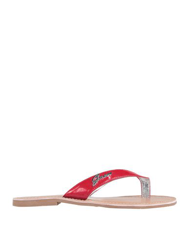 red guess flip flops