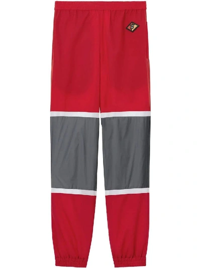 Shop Burberry Logo Graphic Striped Nylon Trackpants