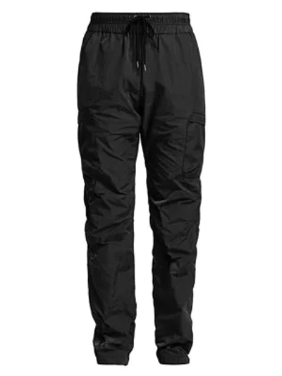 Shop John Elliott High Shrunk Nylon Cargo Pants In Black