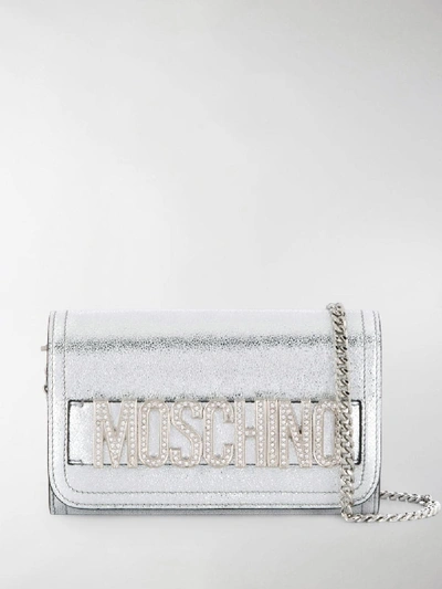 Shop Moschino Embellished Logo Clutch Bag In Silver