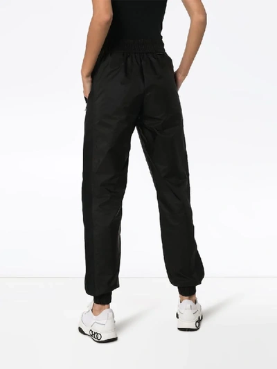 Shop Moncler Panelled Shell Track Pants In Black