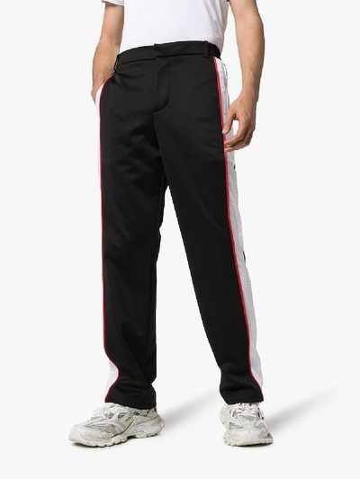 Shop Burberry Sports Stripe Trousers In Black