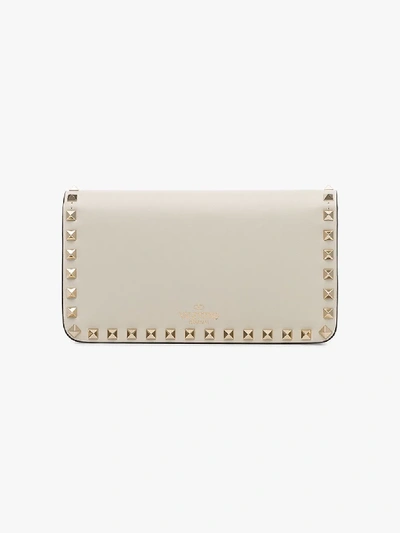 Shop Valentino White Rockstud Leather Clutch Bag