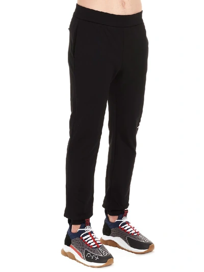 Shop Versace Trousers In Nero