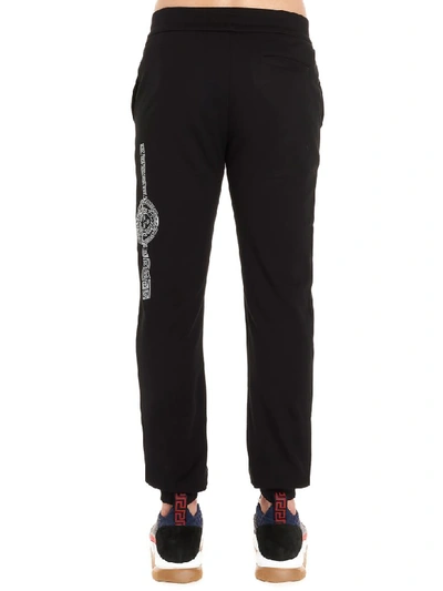 Shop Versace Trousers In Nero