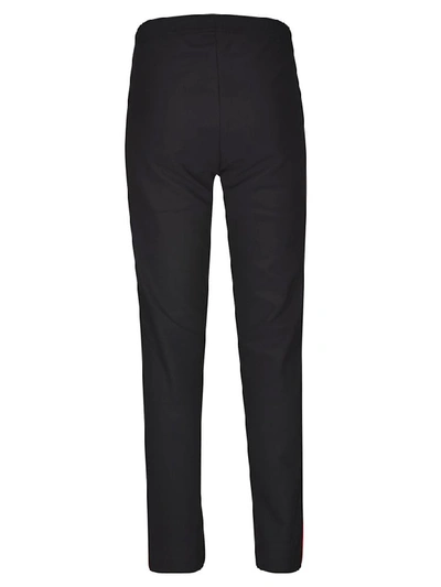 Shop Moncler Side Striped Trousers In Black