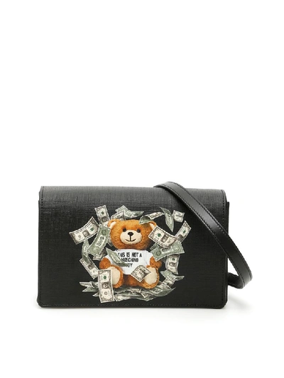 Shop Moschino Dollar Teddy Bear Crossbody Bag In Black (black)