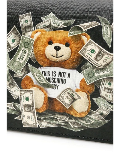 Shop Moschino Dollar Teddy Bear Crossbody Bag In Black (black)