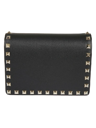 Shop Valentino Pyramid Studded Pouch In Black/gold