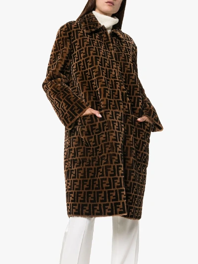 Shop Fendi Ff Print Reversible Leather And Shearling Coat In Brown