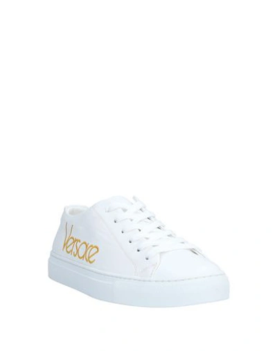 Shop Versace Sneakers In White